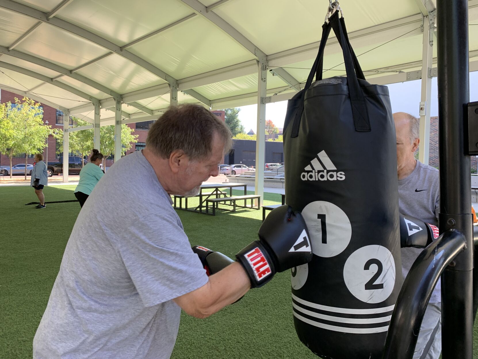 Robert Schack hits boxing bag
